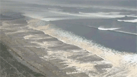 Tsunami wave hitting the coast of north Japan